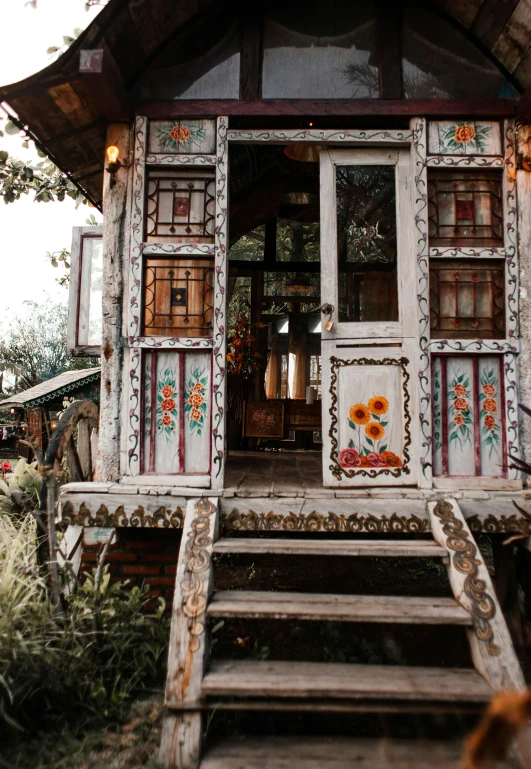 a small house sitting on top of a lush green field, by Emma Andijewska, maximalism, outside a saloon, bangkok, rustic and weathered, profile image