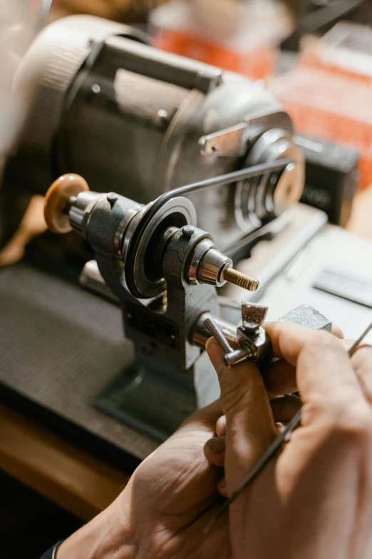 a close up of a person working on a machine, trending on pexels, arts and crafts movement, lasso tool, midcentury modern, instagram photo, collectors