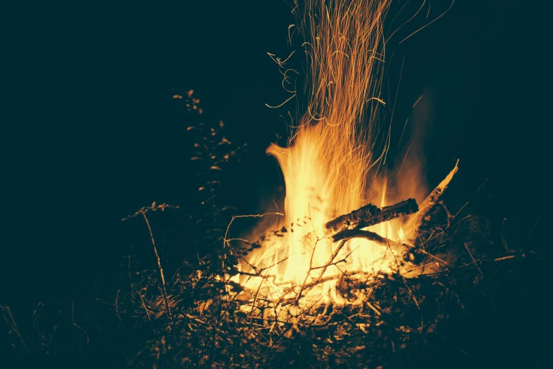 a close up of a fire in the dark, by Caroline Mytinger, pexels contest winner, hurufiyya, instagram post, warm summer nights, rinko kawauchi, illustration »