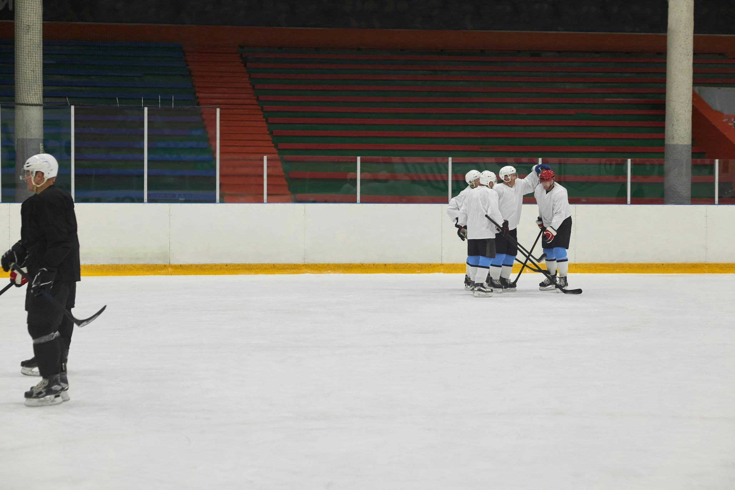 a group of men standing on top of an ice rink, on the field, sparring, cuba, indoor picture