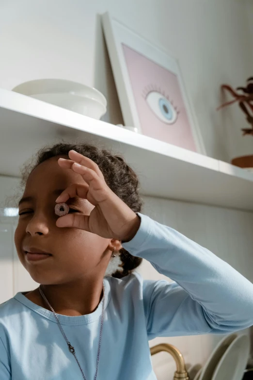 a little girl that is standing in a kitchen, black eye patch over left eye, african american young woman, gen z, partially cupping her hands