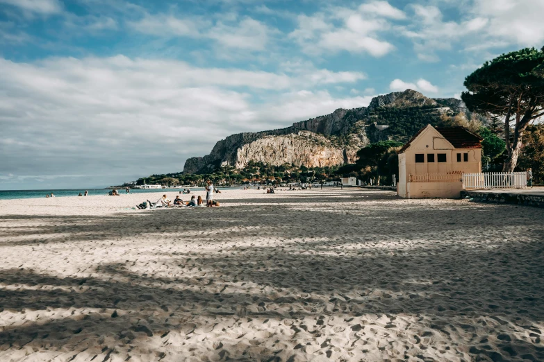 a group of people standing on top of a sandy beach, costa blanca, a cozy, profile image