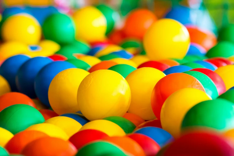 a ball pit filled with lots of colorful balls, by Joe Bowler, pexels, 2 5 6 x 2 5 6 pixels, very shallow depth of field, the poolrooms, striped