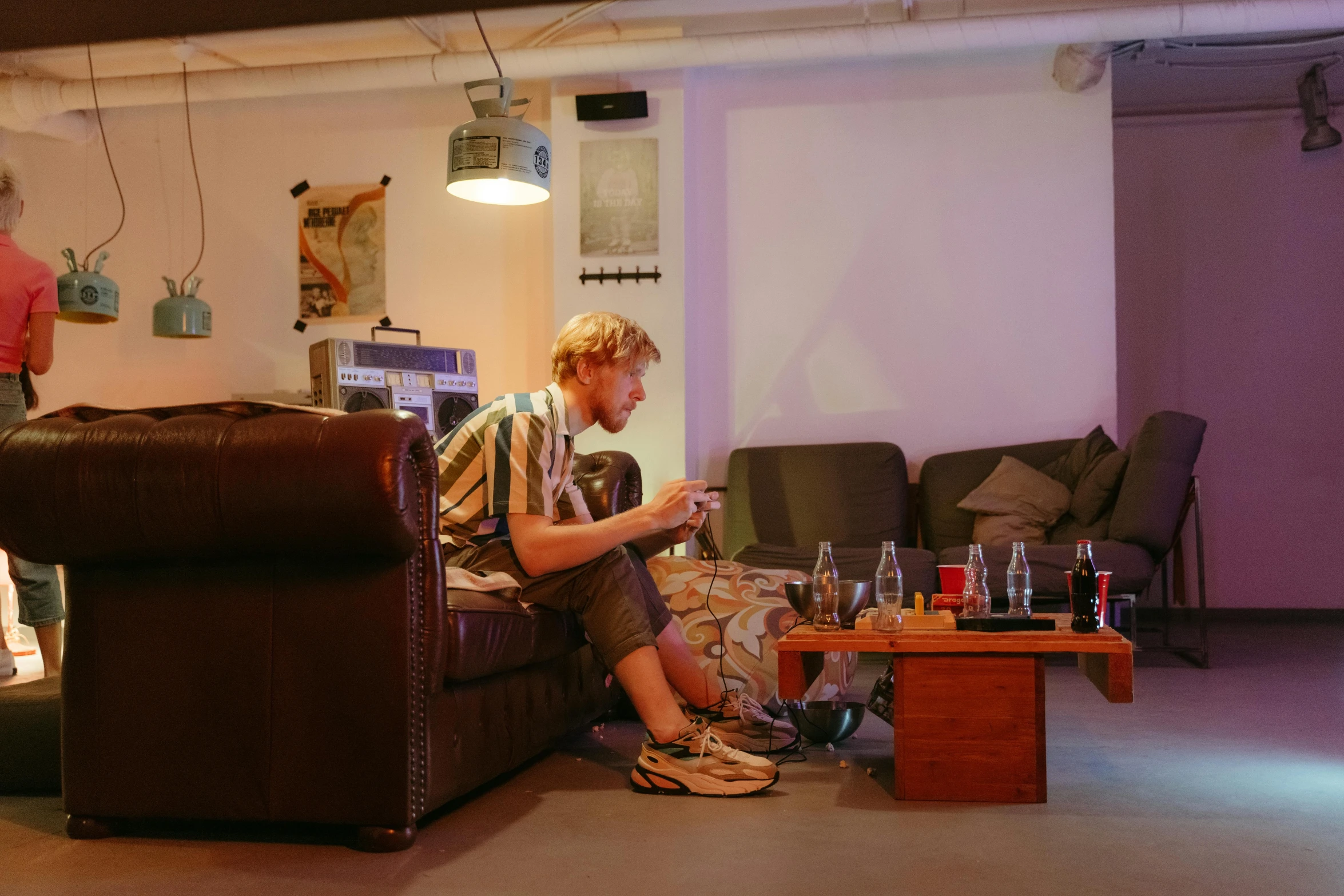 a man sitting on a couch in a living room, by Jan Tengnagel, unsplash, in a basement, ultrastation hq, eating, low quality photo