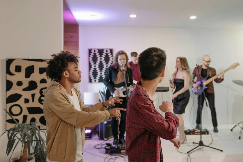 a group of people that are standing in a room, an album cover, pexels, performing a music video, in house, thumbnail, band playing