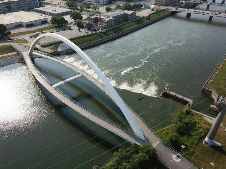 an aerial view of a bridge over a river, inspired by Tadao Ando, cleveland, sweeping arches, design award winner, iu