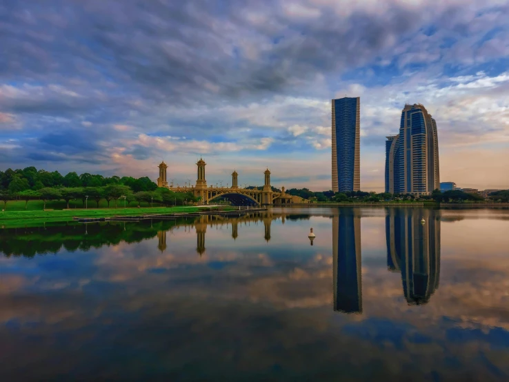 a large body of water surrounded by tall buildings, by Ibrahim Kodra, pexels contest winner, royal garden landscape, reflective gradient, sangyeob park, scenic view of river