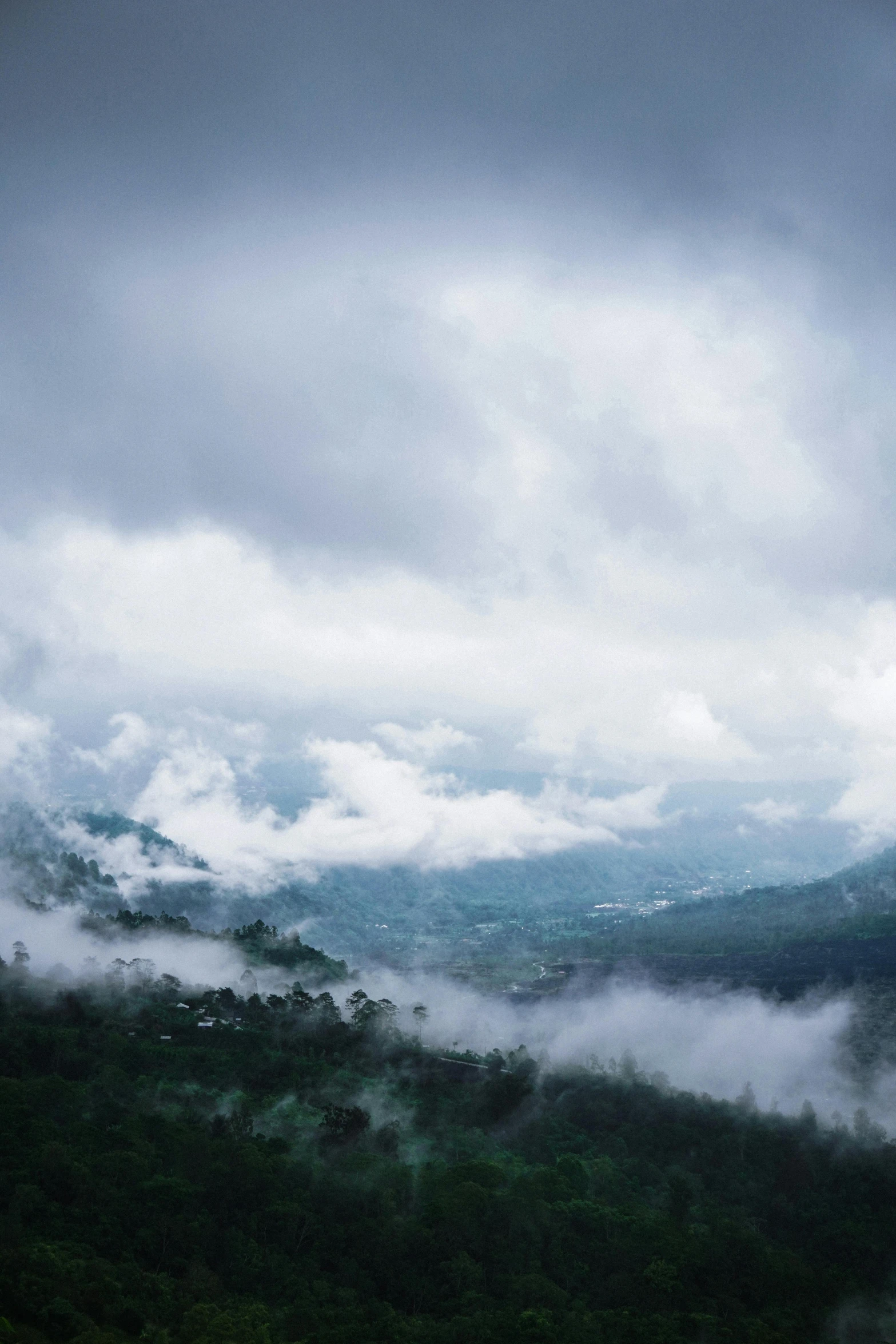 the view from the top of a mountain on a cloudy day, inspired by Elsa Bleda, hurufiyya, sri lanka, “puffy cloudscape, album