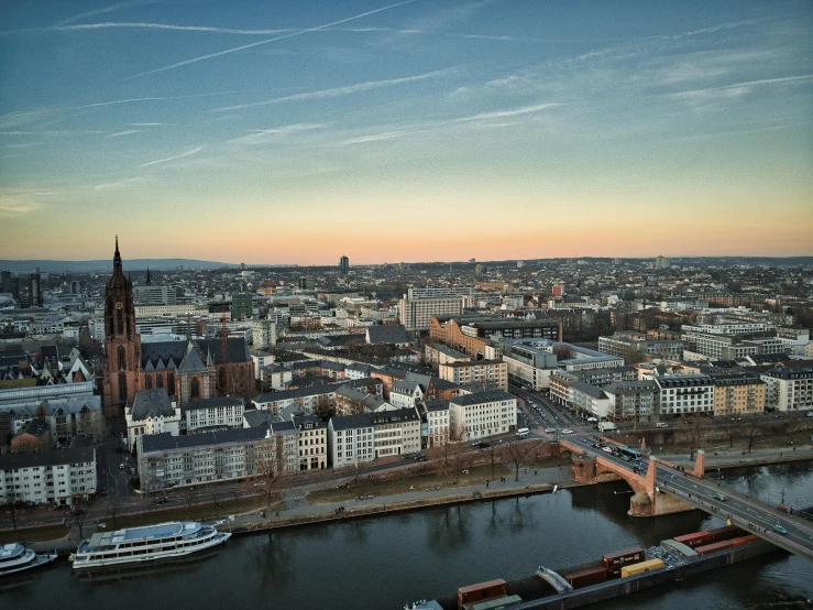 a large body of water next to a city, by Tobias Stimmer, pexels contest winner, germany. wide shot, koyaanisqatsi, overlooking, ad image