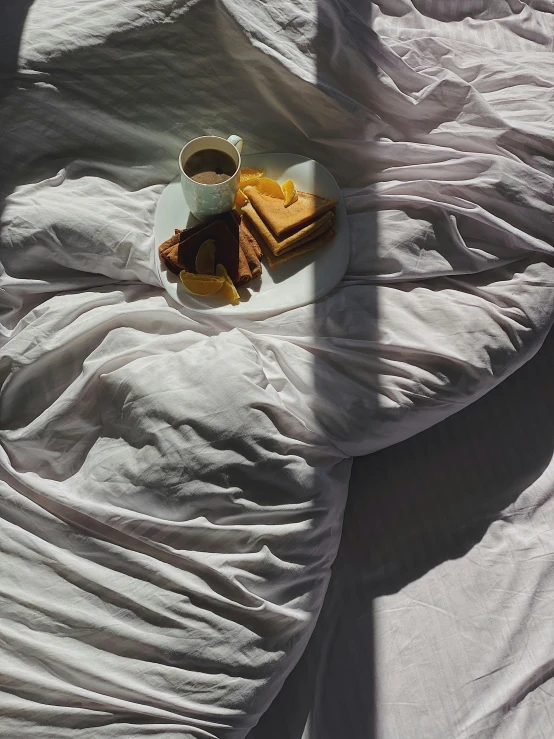 a plate of food sitting on top of a bed, inspired by Elsa Bleda, unsplash contest winner, hyperrealism, morning sunlight, ignant, portrait of morning coffee, white and pink cloth