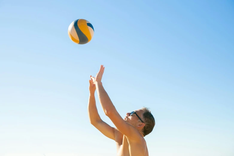 a man standing on top of a beach next to a ball, profile image, volleyball, sunny day time, avatar image