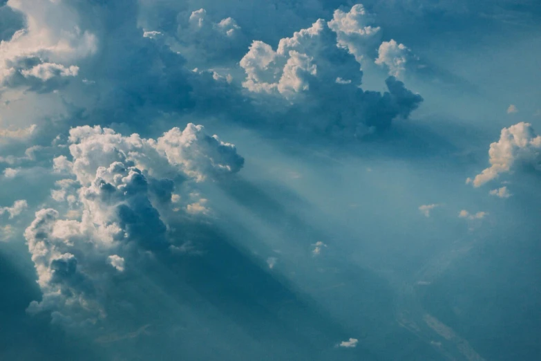 there is a plane that is flying in the sky, pexels contest winner, light and space, cumulus, god light shafts, aerial spaces, paul barson