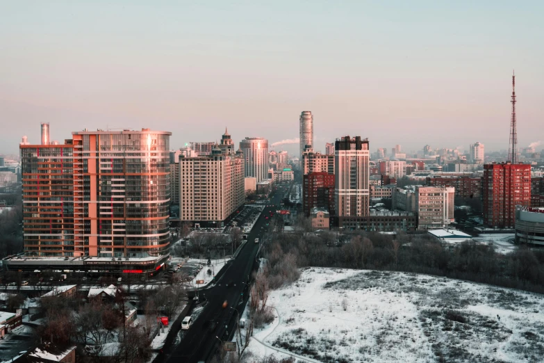 a view of a city from the top of a hill, pexels contest winner, socialist realism, winter photograph, high rise skyscrapers, 000 — википедия, sovietwave aesthetic