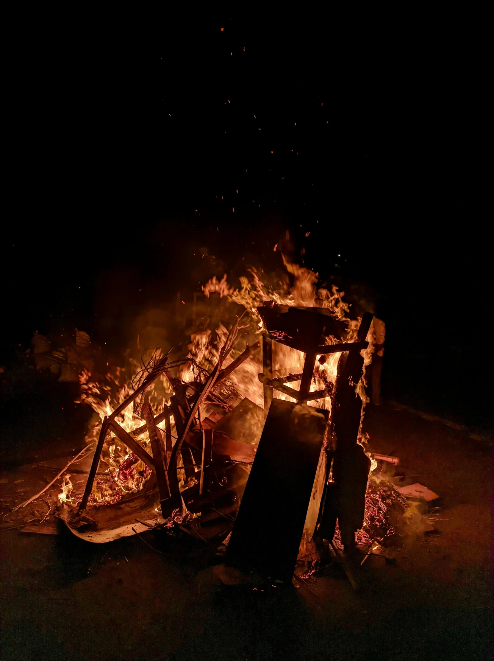 a group of people standing around a bonfire, by Niko Henrichon, conceptual art, riot shields, photograph taken in 2 0 2 0, in junkyard at night, on a black background