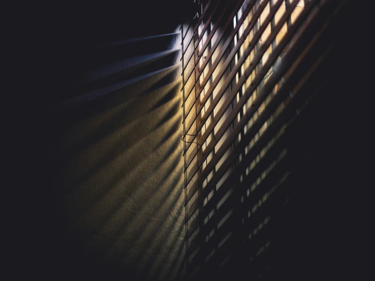 a light shines through the blinds in a dark room, inspired by Elsa Bleda, pexels contest winner, metal shutter, instagram post, high shadow, multiple stories