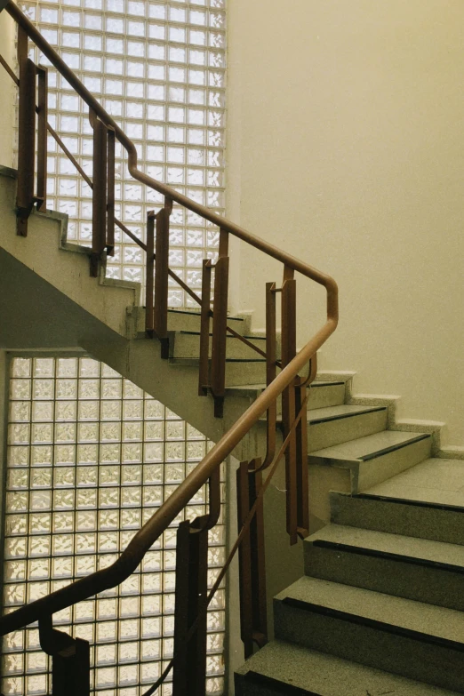a staircase in a building with a glass block wall, by Bauhaus, bauhaus, art deco era), stone stairway, lattice, neoclassical