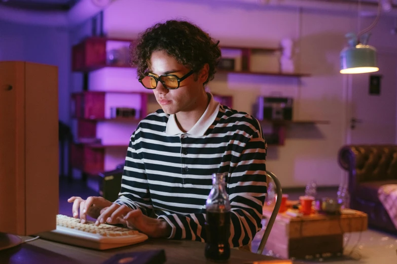 a woman sitting at a table typing on a keyboard, pexels, serial art, jewish young man with glasses, sci-fi themed, vintage glow, teenage engineering moad