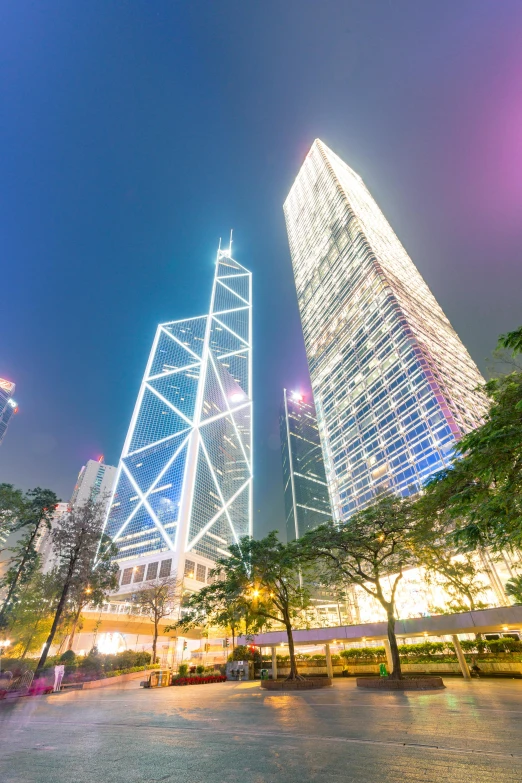 a city at night with skyscrapers in the background, a picture, hong kong buildings, avatar image, square, 4 k ]