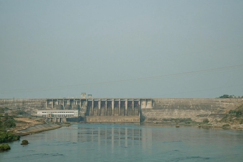 a body of water with a dam in the background, aketan, on grey background, thumbnail, multiple stories