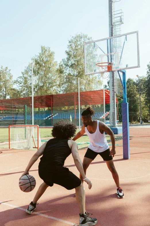 a couple of people playing a game of basketball, trending on dribble, square, center of image, commercial, brown