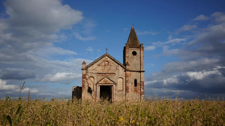 an old church in the middle of a corn field, by Lucia Peka, pexels contest winner, romanesque, joel sternfeld, mantegna, (rust), exterior view