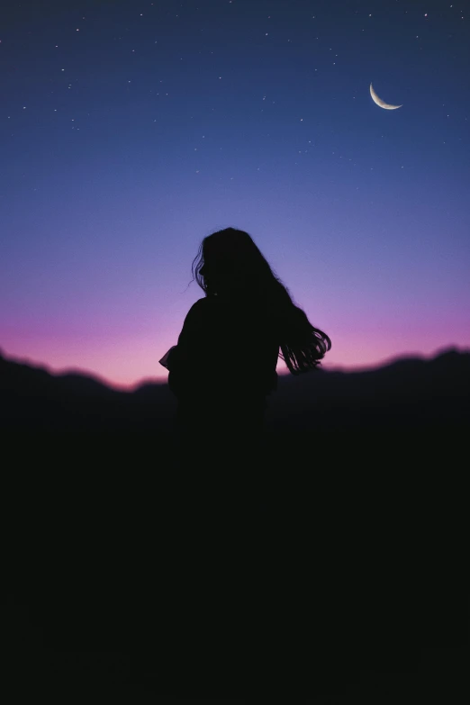 a person sitting on top of a hill under a night sky, an album cover, unsplash contest winner, her loose hair, silhouette :7, human staring blankly ahead, 256435456k film