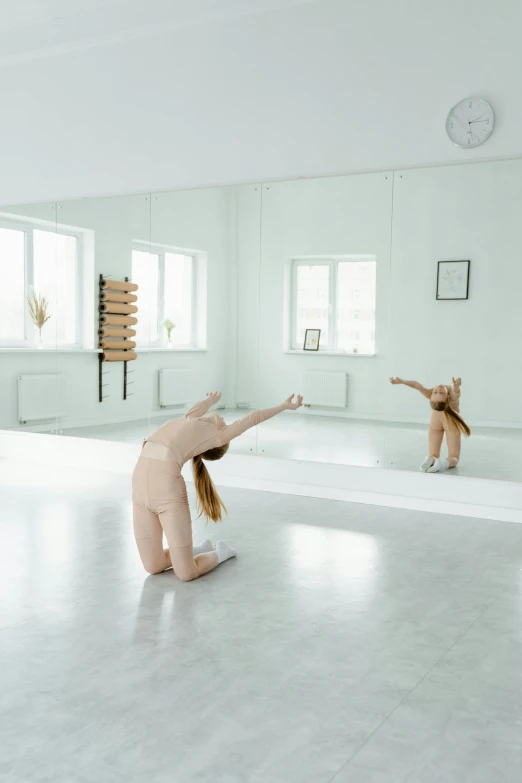 a woman doing a handstand in a dance studio, an album cover, by Elizabeth Polunin, dada, 2 0 1 8, kirsi salonen, with a mirror, anna nikonova aka newmilky