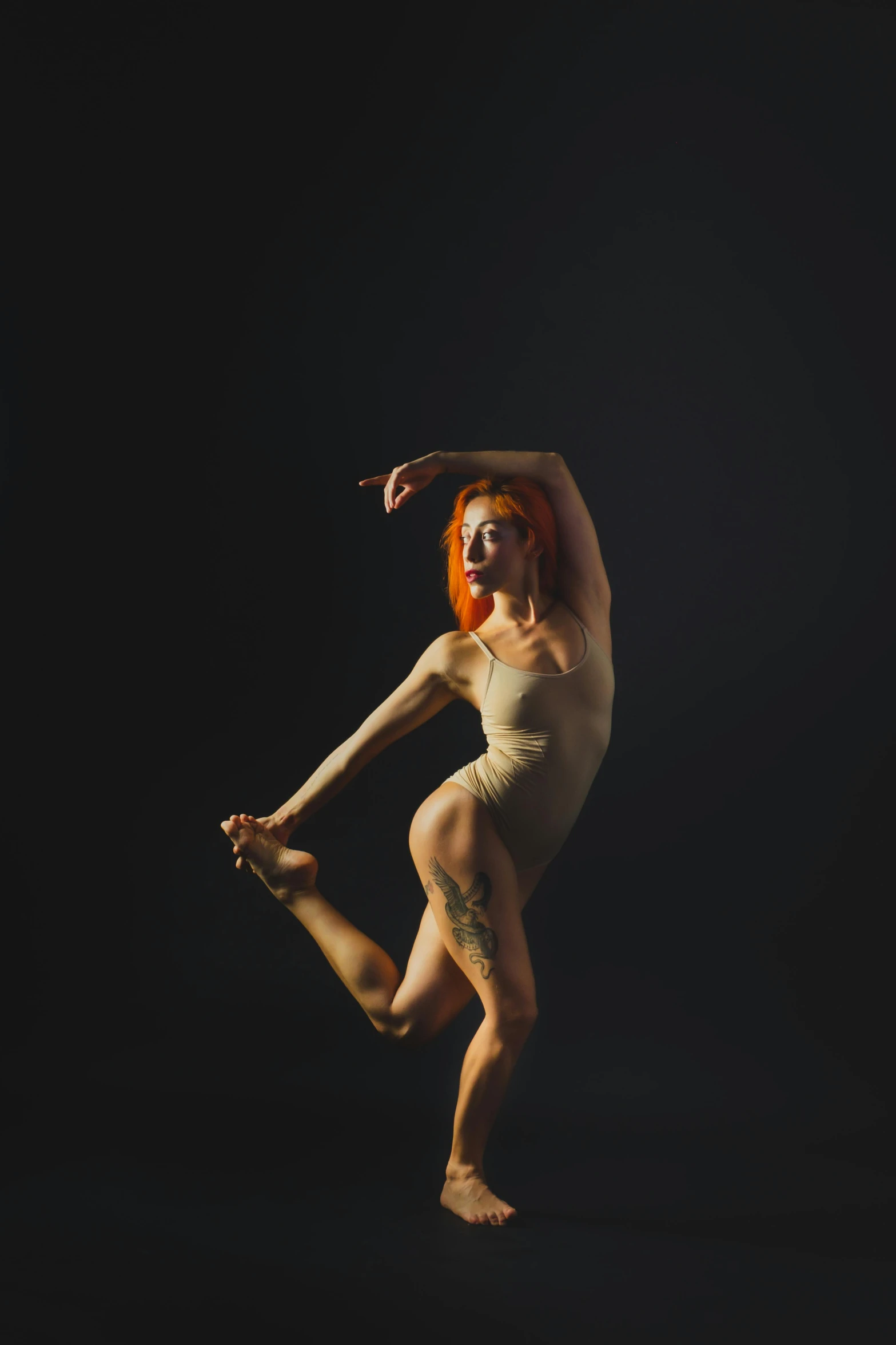 a woman that is standing in the dark, a portrait, inspired by Elizabeth Polunin, unsplash, arabesque, madison beer as leeloo, lois greenfield, high quality photo, fullbody photo