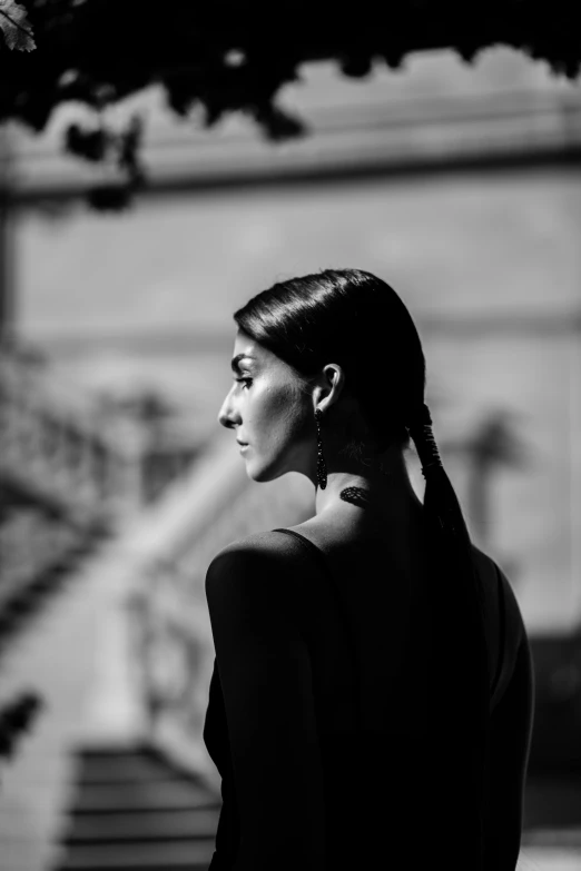 a black and white photo of a woman, by Giuseppe Avanzi, black ponytail, contre - jour, ✨🕌🌙, morena baccarin