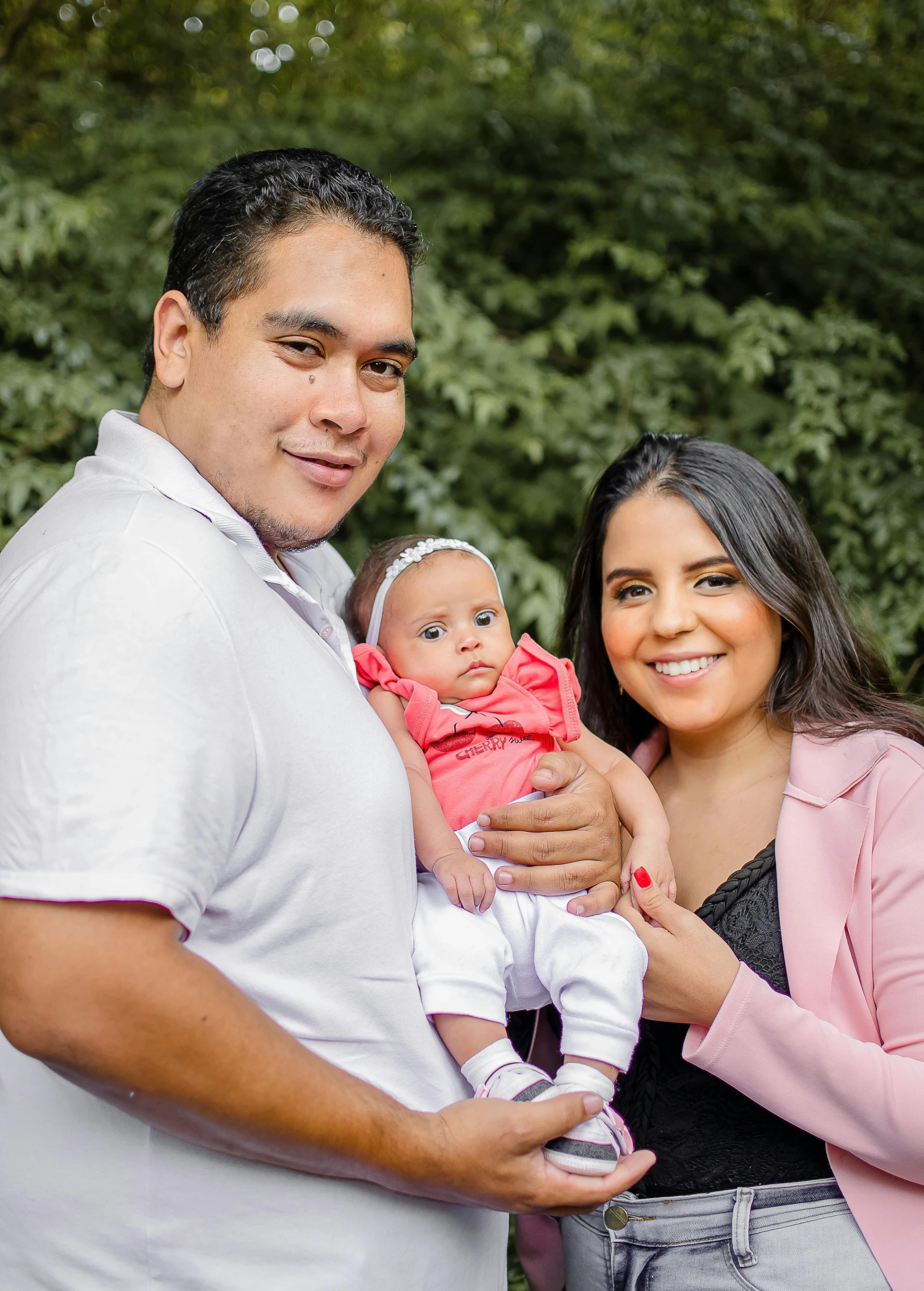 a man standing next to a woman holding a baby, by Manuel Ortiz de Zarate, instagram, 15081959 21121991 01012000 4k, headshot profile picture, latino american, confident looking