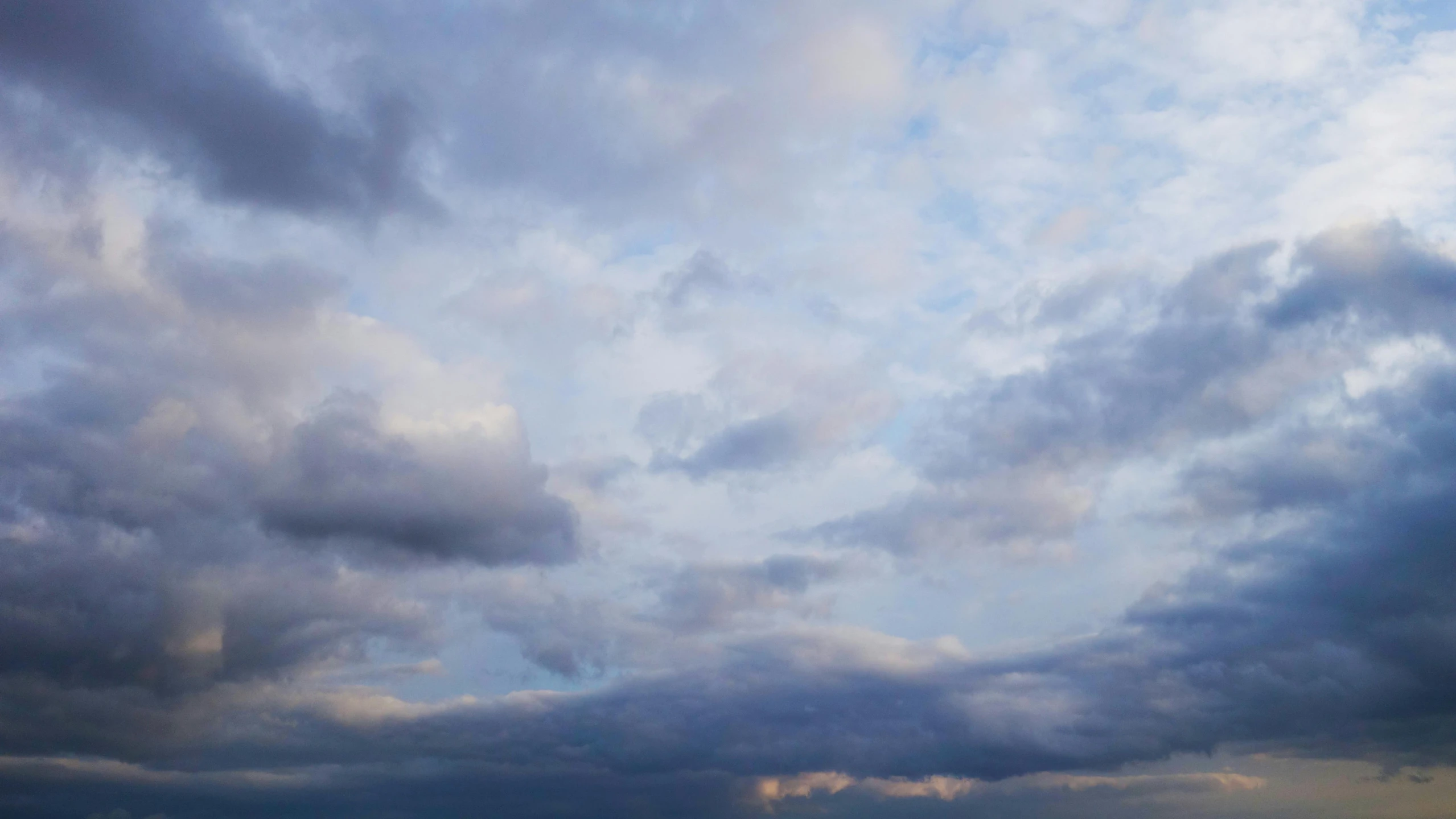 a large body of water under a cloudy sky, by Carey Morris, major arcana sky, colour photograph, grey, detailed sky