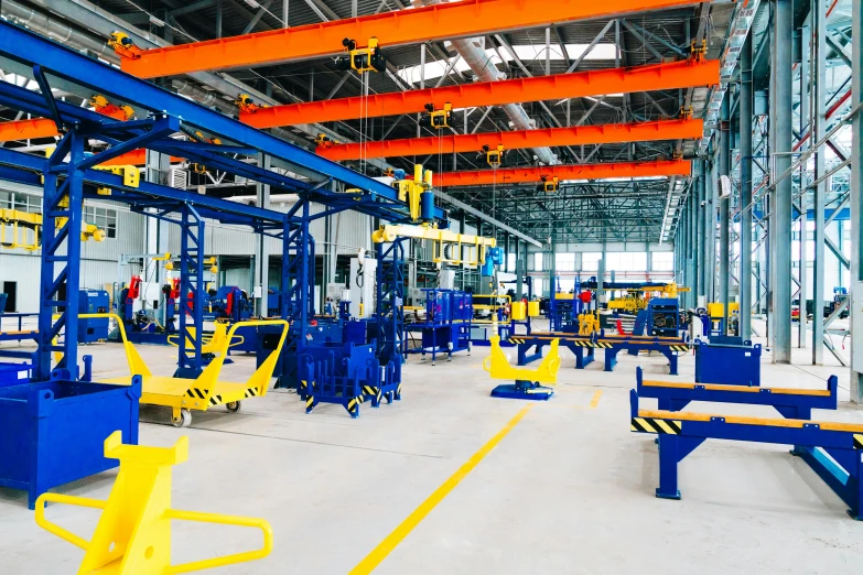 a factory filled with lots of machines and equipment, pexels contest winner, blue theme and yellow accents, square, metal readymade, royal workshop