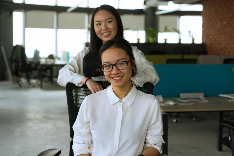 a woman sitting in a chair next to another woman, developers, bao pham, avatar image