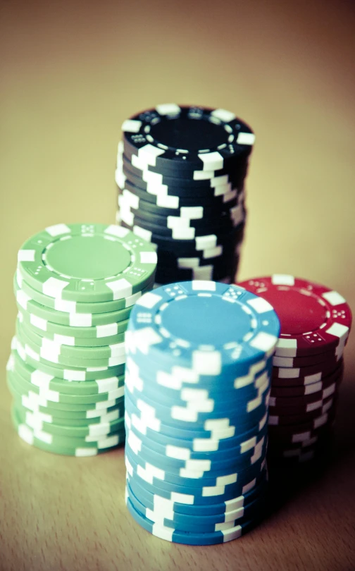 a pile of poker chips sitting on top of a table, unsplash, multiple stories, retro effect, watch photo, uploaded