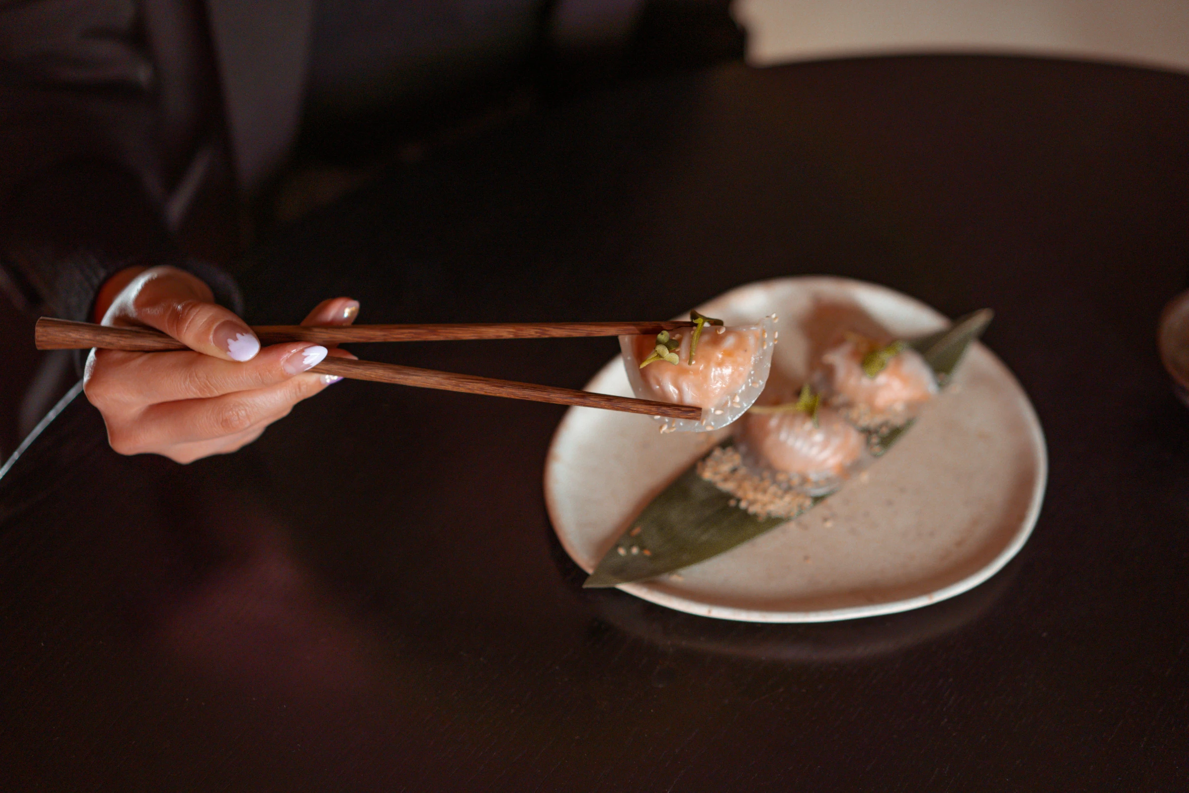 a person holding chopsticks over a plate of food, ukiyo, gushy gills and blush, grey, mid night