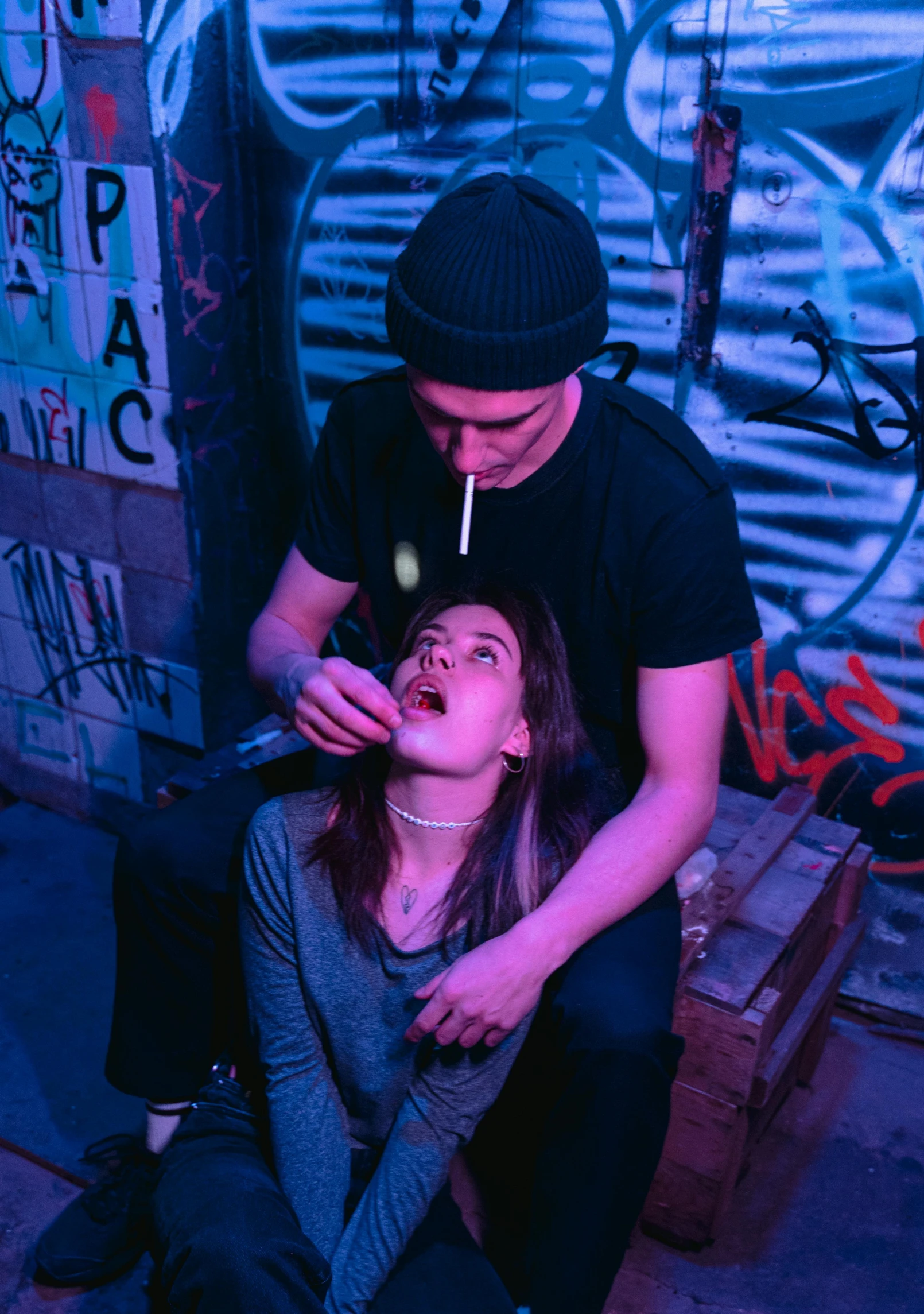 a man putting a cigarette in a woman's mouth, inspired by Elsa Bleda, pexels contest winner, scene from a rave, yung lean, drinking cough syrup, smoking with squat down pose