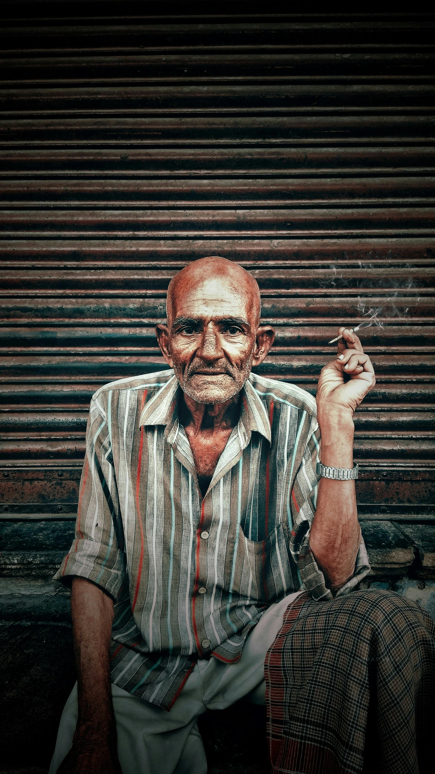 a man sitting on a bench smoking a cigarette, pexels contest winner, hyperrealism, on an indian street, grumpy [ old ], a photograph of a rusty, a handsome