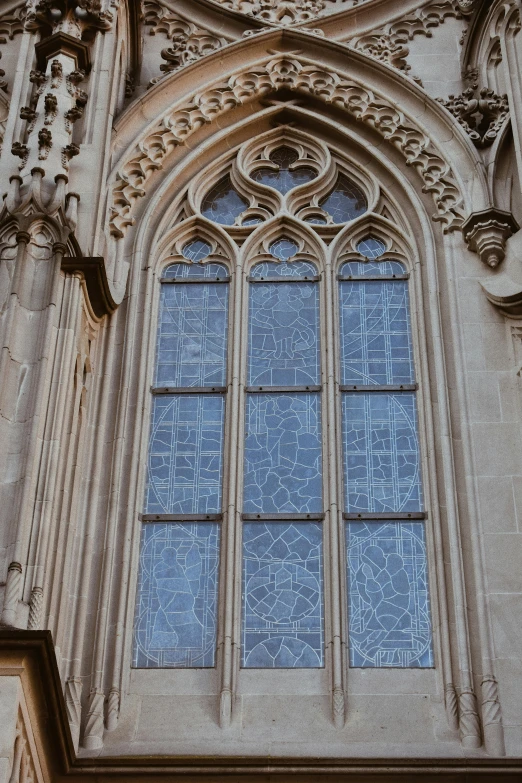 a clock mounted to the side of a building, an etching, inspired by Barthélemy d'Eyck, unsplash, baroque, church window, cast glass, gothic interior, high-body detail