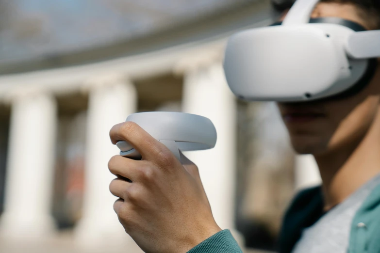 a man using a virtual reality device in front of a building, an ambient occlusion render, unsplash, interactive art, hand holding cap brim, artefact, hovering drone, oled visor over eyes