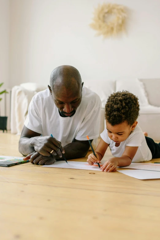 a man and a little boy laying on the floor, a child's drawing, pexels contest winner, virgil abloh, teaching, grandfatherly, 15081959 21121991 01012000 4k