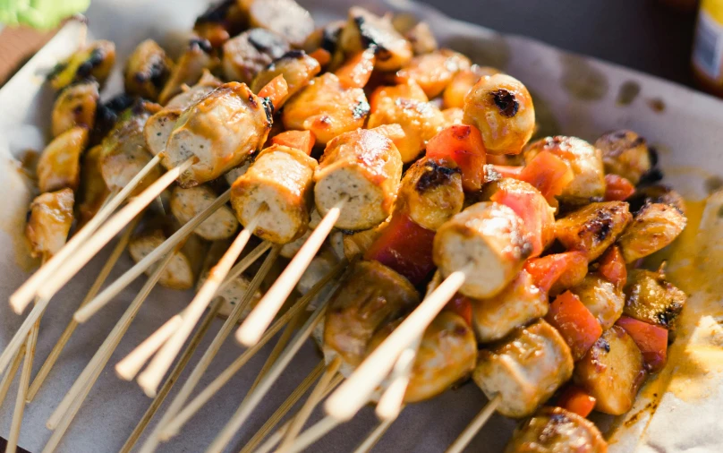 a close up of a plate of food with skewers, profile image, fan favorite, market, manuka