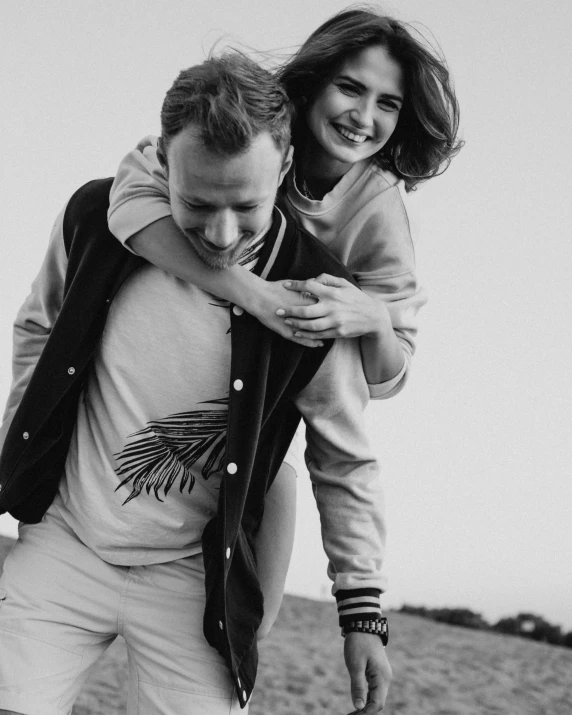 a black and white photo of a man carrying a woman, unsplash, hollister ranch, 15081959 21121991 01012000 4k, instagram post, aleksandra waliszewska