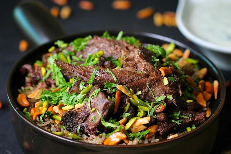 a close up of a bowl of food on a table, hurufiyya, fan favorite, beef, ash thorp khyzyl saleem, thumbnail