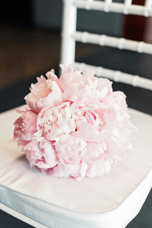 a bouquet of pink flowers sitting on top of a white chair, award-winning crisp details”, fully covered, peony, engineered