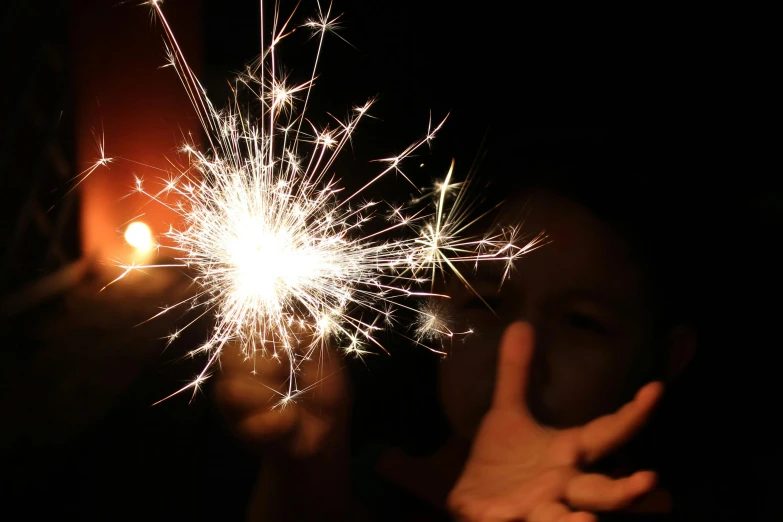 a person holding a sparkler in their hand, pexels contest winner, 5 years old, with sparking circuits, youtube thumbnail, ilustration