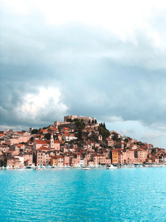 a large body of water with a city on a hill in the background, unsplash contest winner, renaissance, croatian coastline, flooded fishing village, thumbnail, profile pic