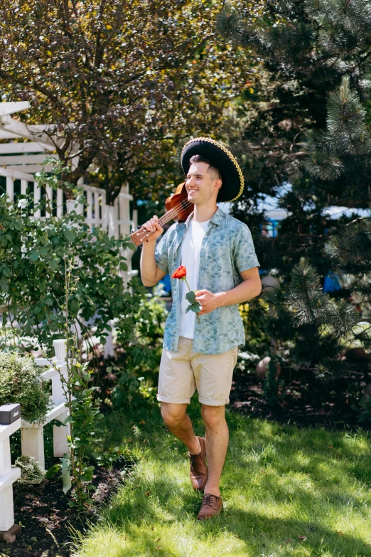 a man that is standing in the grass with a frisbee, standing on top of a violin, rose garden, summer vibes, profile image