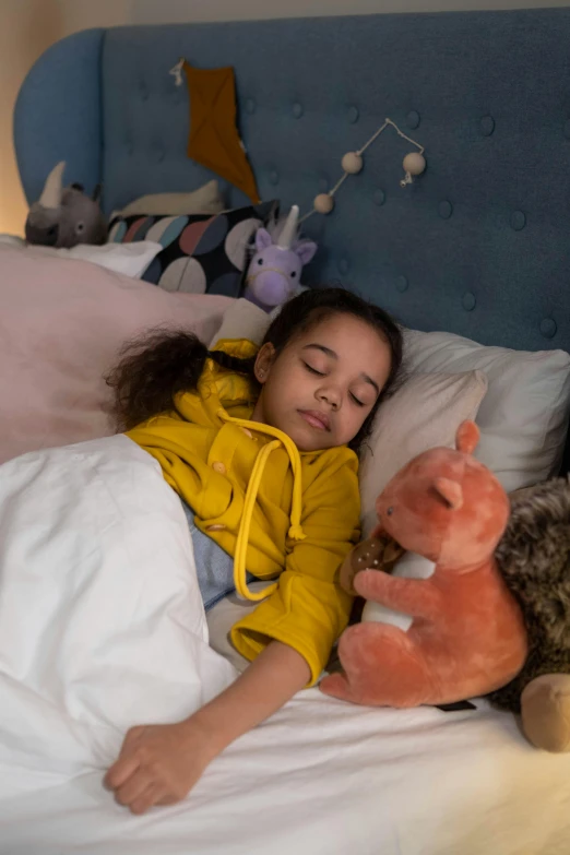 a little girl laying in bed with stuffed animals, inspired by Sophie Anderson, headspace, horns, multi - coloured, amber