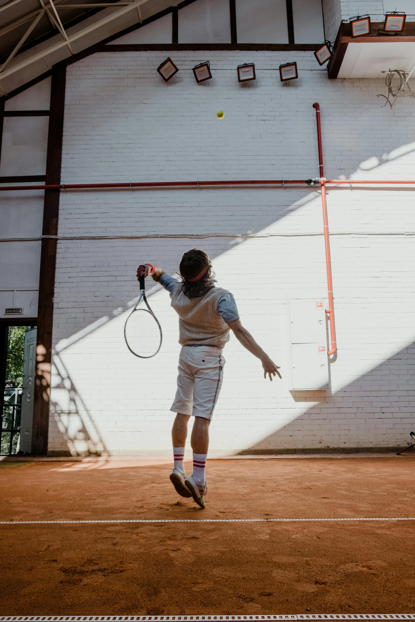 a man standing on top of a tennis court holding a racquet, by Jan Tengnagel, happening, performance, indoor picture, let's play, instagram post