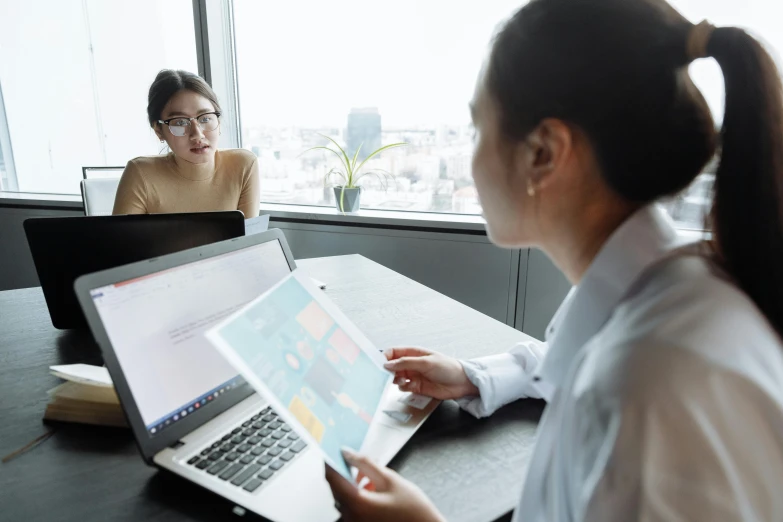 a woman sitting in front of a laptop computer, pexels contest winner, in meeting together, avatar image, high resolution image